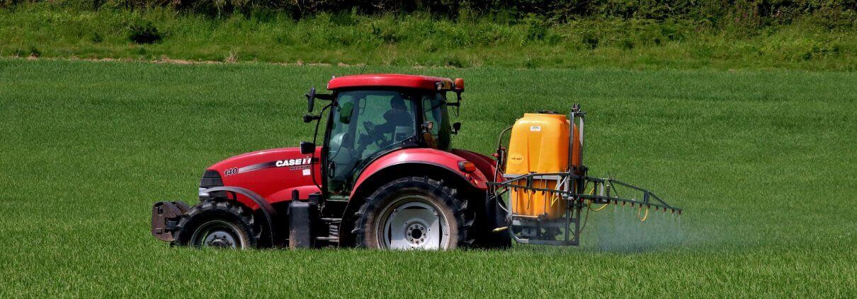 Tractor spraying herbicides